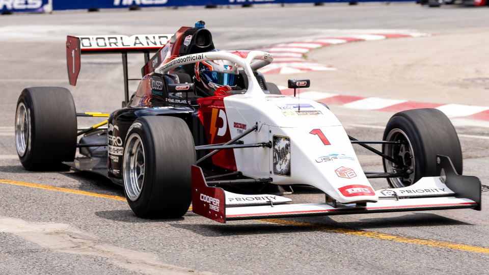 Indy Lights car through turn 1 at the Honda Indy Toronto