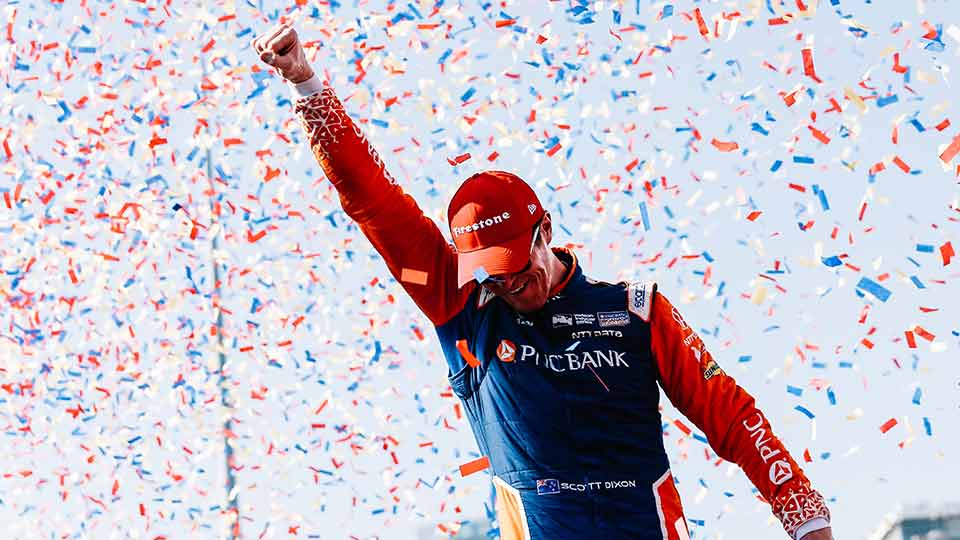Scott Dixon celebrates in victory circle